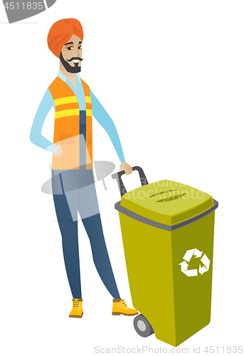 Image of Young hindu builder pushing recycle bin.