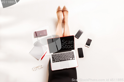Image of Fashion blogger writing on laptop computer
