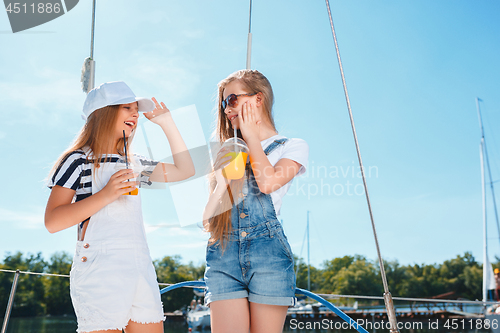 Image of The children on board of sea yacht