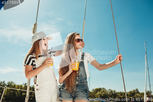 Image of The children on board of sea yacht