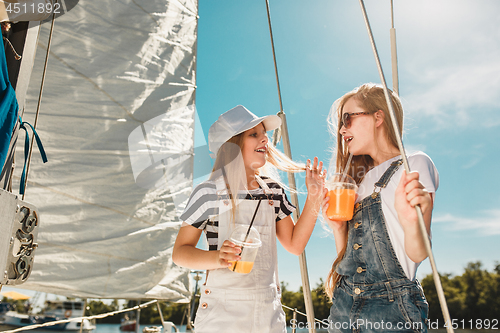 Image of The children on board of sea yacht