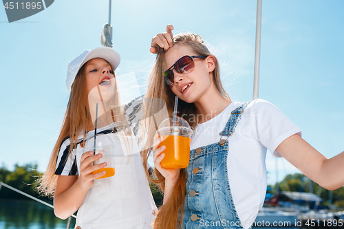 Image of The children on board of sea yacht