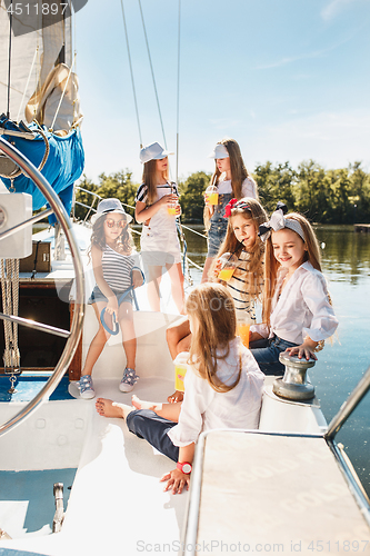 Image of The children on board of sea yacht