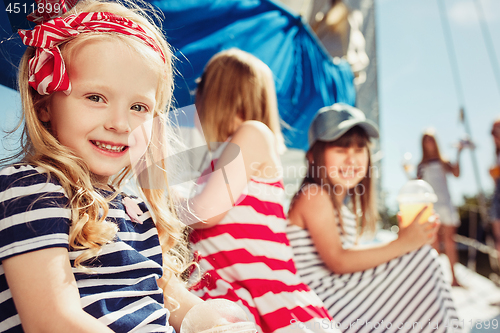 Image of The children on board of sea yacht