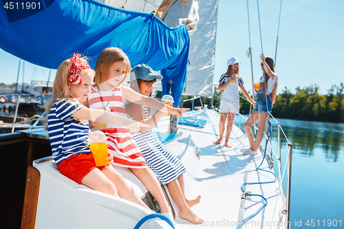 Image of The children on board of sea yacht