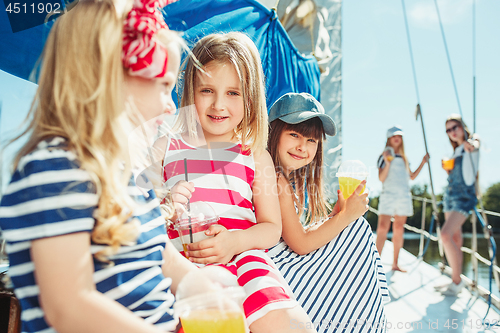 Image of The children on board of sea yacht