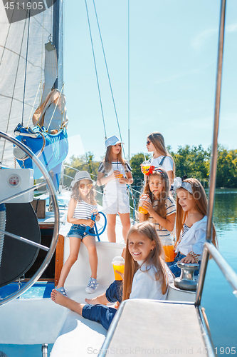 Image of The children on board of sea yacht