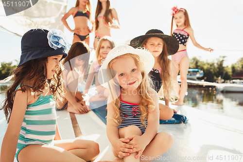 Image of The children on board of sea yacht