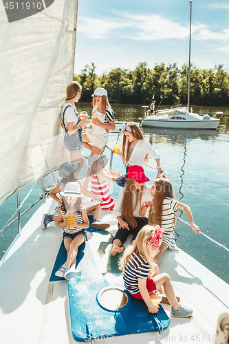 Image of The children on board of sea yacht