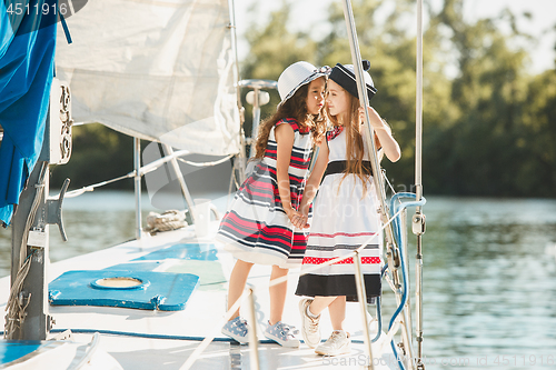 Image of The children on board of sea yacht