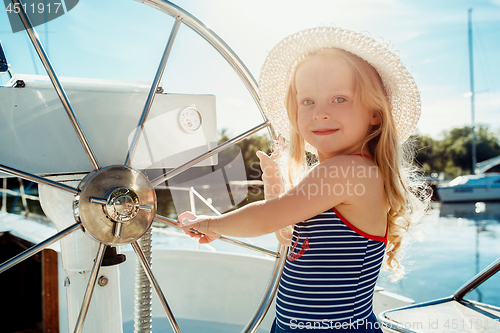 Image of The children on board of sea yacht