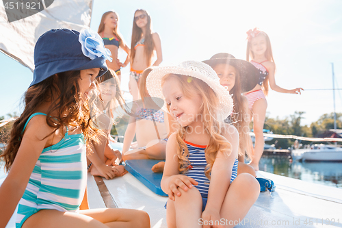 Image of The children on board of sea yacht