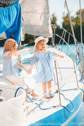 Image of The children on board of sea yacht