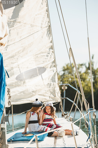 Image of The children on board of sea yacht