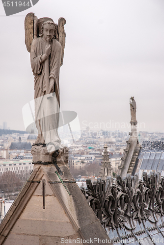 Image of Angel is playing an horn