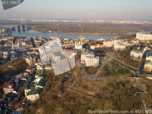 Image of A bird\'s eye view, aerial view shooting from drone of the Podol district, oldest historical center of Kiev, the Dnieper River and the left bank of Dnieper in the city of Kiev, Ukraine.