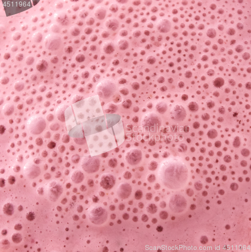 Image of Macro photo of berry healthy pink smoothie with bubbles. Food background. Tip view