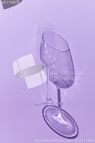 Image of Wine Glass with shadow on purple background