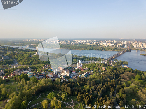 Image of Aerial view beautiful panorama of the city of Kiev, a botanical garden and the Dnieper river against the blue sky