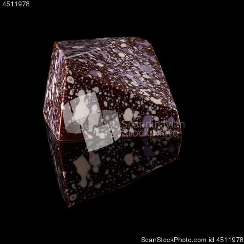 Image of chocolate candy on black background