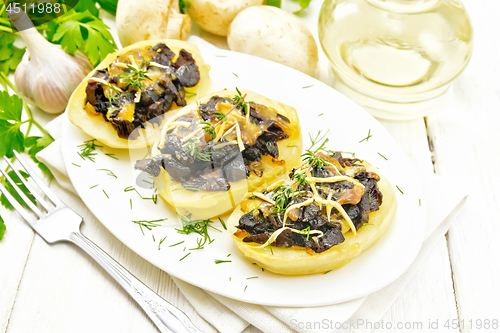 Image of Potatoes stuffed with mushrooms on light board