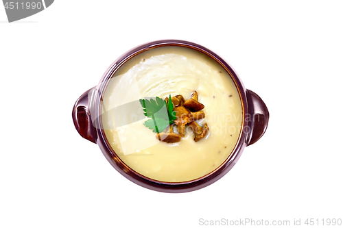 Image of Soup-puree mushroom in clay bowl on top