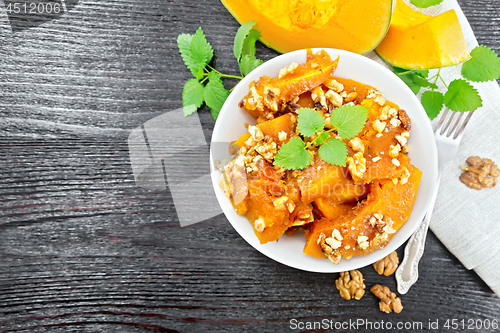 Image of Pumpkin with nuts and honey on board top