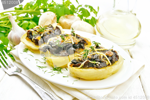 Image of Potatoes stuffed with mushrooms on white board