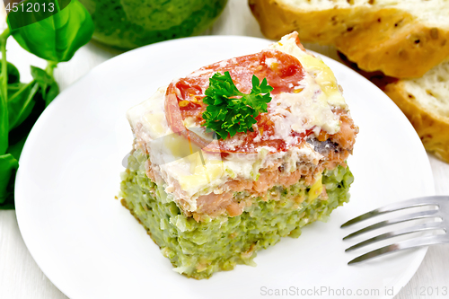 Image of Casserole of salmon and rice on board