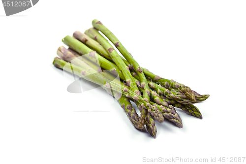 Image of Bunch of fresh raw garden asparagus isolated on white background