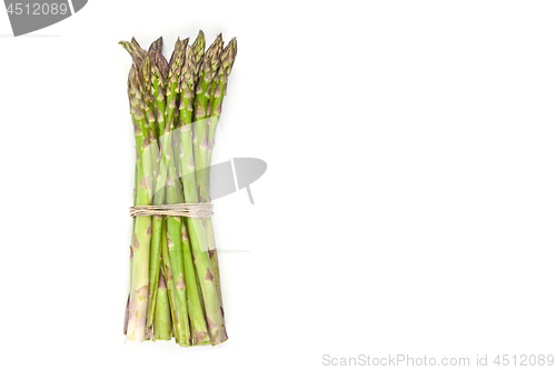 Image of Bunch of fresh raw garden asparagus isolated on white background