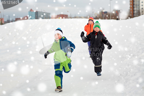 Image of happy little kids playing outdoors in winter