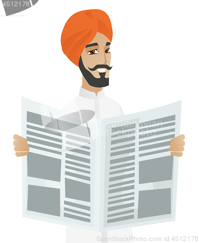 Image of Hindu businessman reading newspaper.