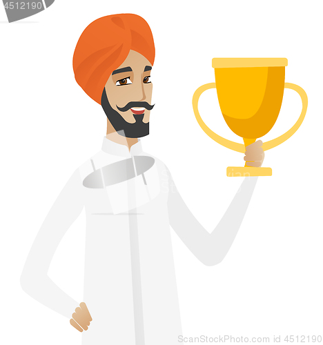 Image of Hindu businessman holding a trophy.