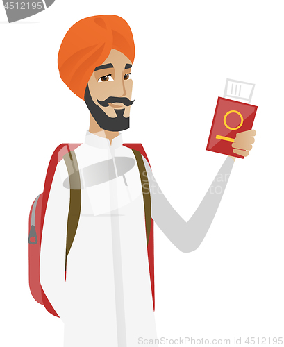 Image of Hindu man traveler holding passport with ticket.