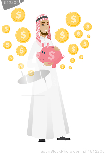 Image of Muslim businessman holding a piggy bank.