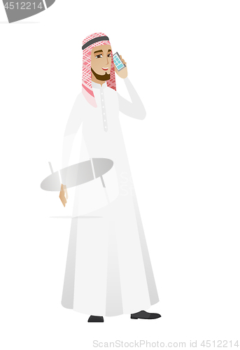 Image of Businessman talking on a mobile phone.