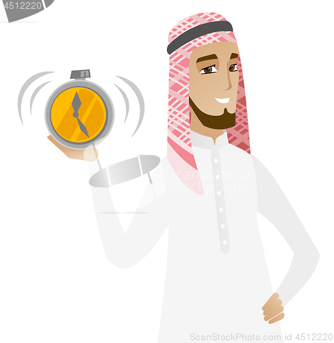 Image of Muslim businessman holding alarm clock.