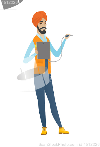 Image of Young hindu electrician with electrical equipment.
