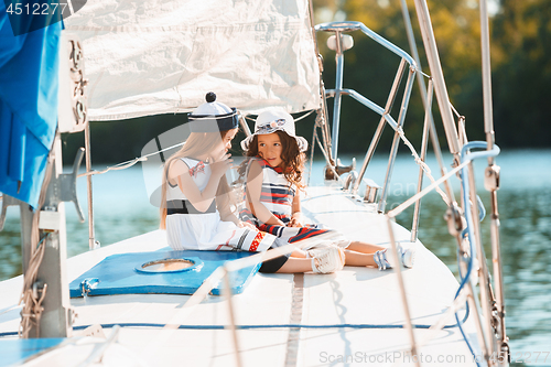 Image of The children on board of sea yacht