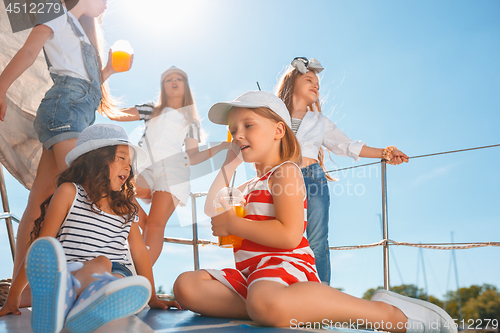 Image of The children on board of sea yacht