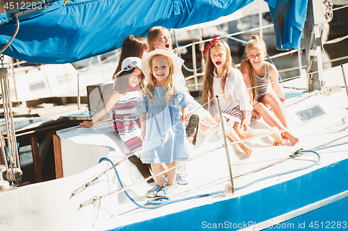 Image of The children on board of sea yacht