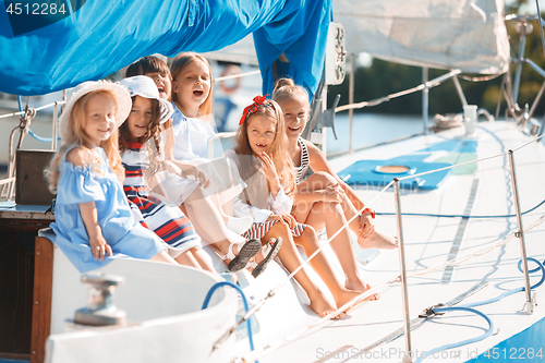 Image of The children on board of sea yacht