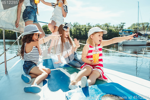 Image of The children on board of sea yacht