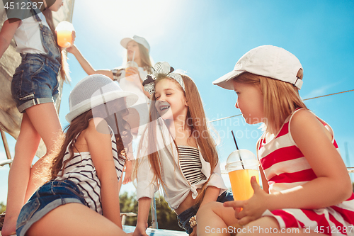 Image of The children on board of sea yacht