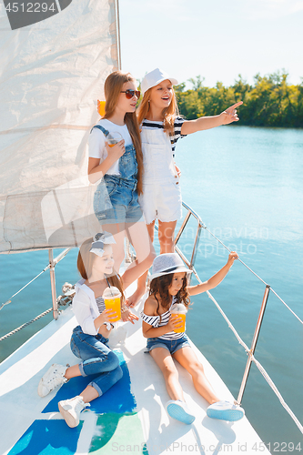 Image of The children on board of sea yacht