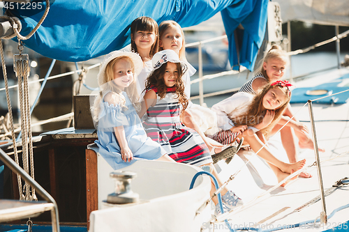 Image of The children on board of sea yacht