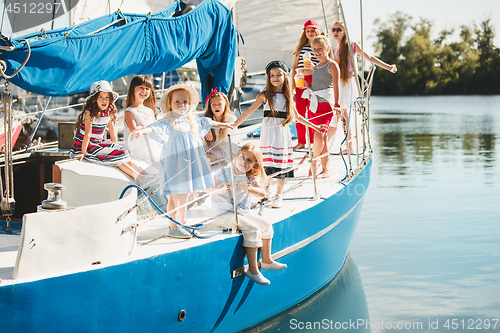 Image of The children on board of sea yacht