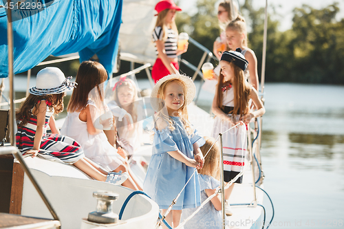 Image of The children on board of sea yacht