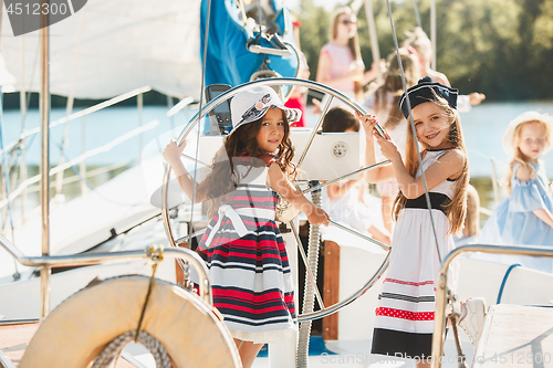 Image of The children on board of sea yacht